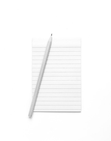 Blank note paper with lines and pencil on white backgroundの写真素材