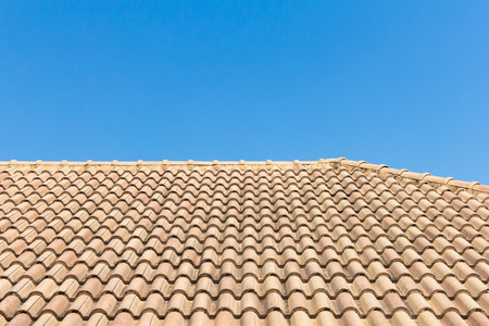 View of roof tiles and blue sky on the backgroundの写真素材