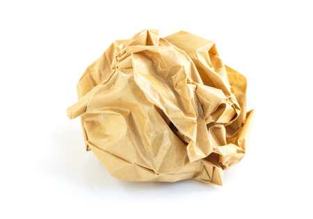 Brown crumpled paper isolated on whiteの写真素材