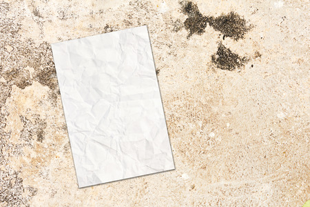 Close up white paper on wall cement texturesの写真素材