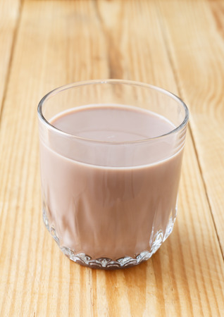 glass of chocolate milkshake on the tableの写真素材