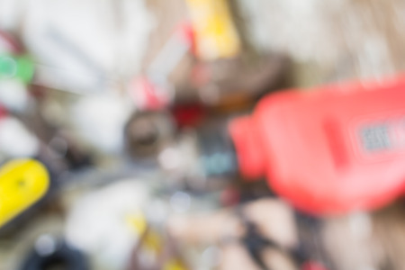 Dirty set of hand tools on a wooden panel focus blur backgroundの写真素材