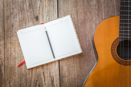 Notebook with guitar for writing music , Concept of musicの写真素材