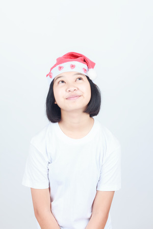 young attractive asian girl in Santa hatの写真素材