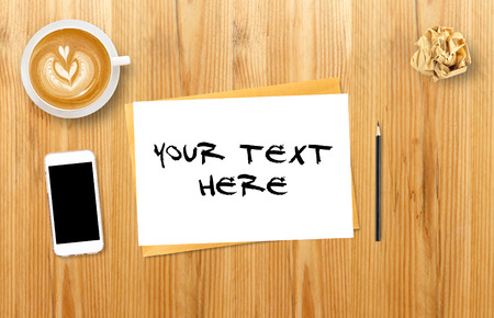 Blank open notebook with coffee cup and mobile, Business template mock up for adding your text