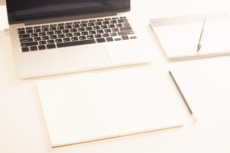Close-up of comfortable working place with laptop, vintage effect style, selective focusの写真素材