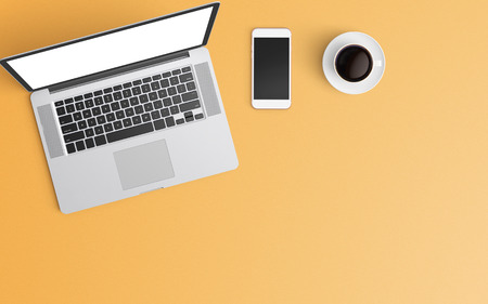Minimal workspace with laptop, coffee cup and smartphone copy space on color background. Top view. Flat lay style.の写真素材