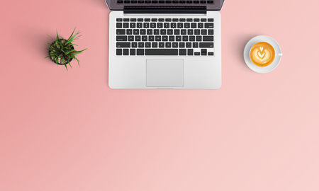 Minimal workspace with Laptop, coffee cup and smartphone copy space on color background. Top view. Flat lay style.の写真素材