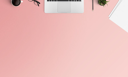 Minimal workspace with Laptop, coffee cup and smartphone copy space on color background. Top view....