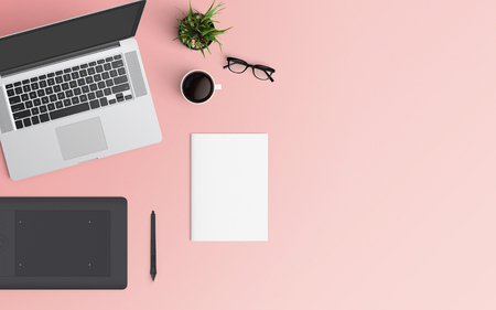 Minimal workspace with laptop, coffee cup and graphic tablet copy space on color background. Top view. Flat lay style.の写真素材