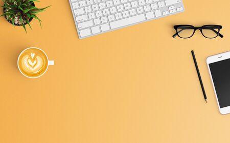 Modern workspace with coffee cup, keyboard and smartphone copy space on orange color background. Top view. Flat lay style.の写真素材