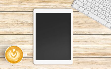 Modern workspace with coffee cup, tablet or smartphone and keyboard copy space on wood background....
