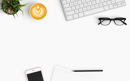 Modern workspace with coffee cup, smartphone, paper and keyboard copy space on white color background. Top view. Flat lay style.の写真素材