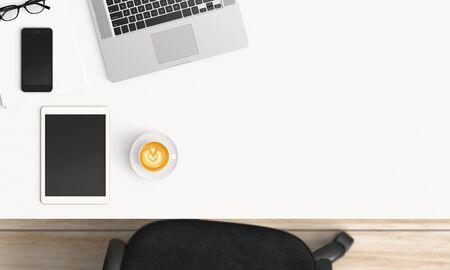 Modern workplace with coffee cup and smartphone or laptop copy space on office table background. Top view. Flat lay styleの写真素材