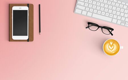 Modern workspace with coffee cup, notebook, smartphone and laptop copy space on pink color background. Top view. Flat lay style.の写真素材