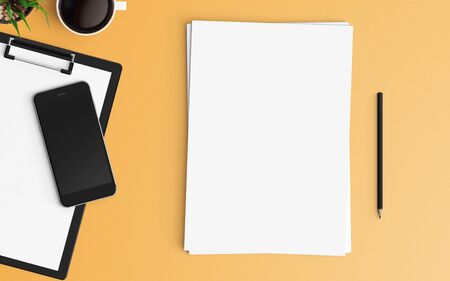 Modern office desk workplace with blank paper, pencil and smartphone copy space on color background. Top view. Flat lay style.の写真素材