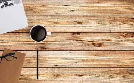 Modern workspace with laptop, coffee cup pencil and envelope copy space on color background. Top view. Flat lay style.の写真素材