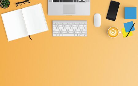 Modern workspace with coffee cup, paper, smartphone, notebook and laptop copy space on orange color background. Top view. Flat lay style.の写真素材