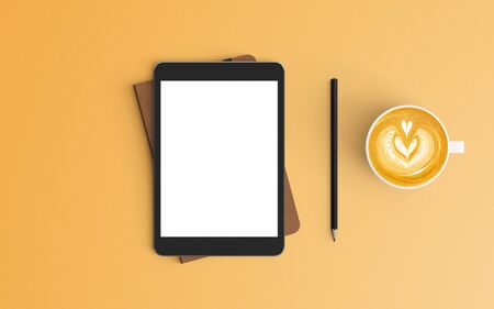 Modern workspace with coffee cup, notebook and tablet copy space on orange color background. Top view. Flat lay style.の写真素材