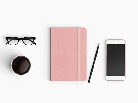 Modern office desk workplace with notebook diary, coffee cup, pencil and smartphone copy space on white desk background. Top view. Flat lay style.の写真素材