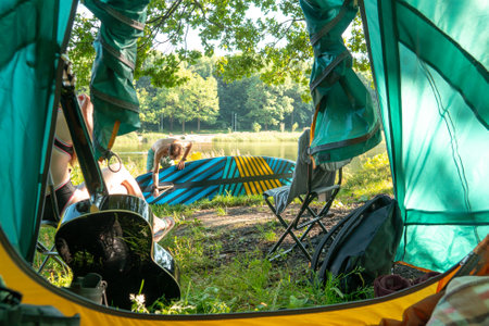 Unrecognizable travelers preparing to ride on sup boardの写真素材