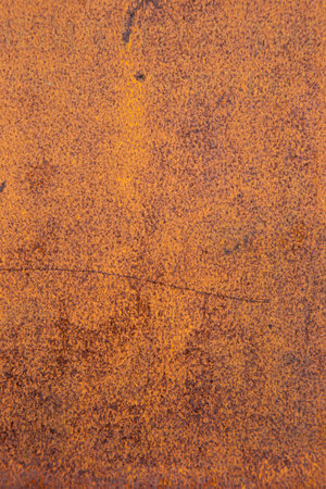 Close-up dark worn rusty metal texture. Grunge orange brown steel stone. Old metal iron oxidized...