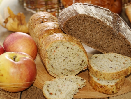 Different kinds of bread  on the wooden tableの写真素材