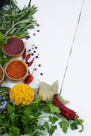 Different kinds of seasonings and herbs on the white oak tableの写真素材