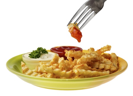 Fresh tasty french fries on the white isolated background with souce and chicken nuggets