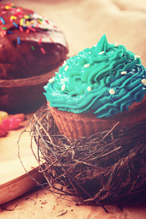Sweet easter christmas birthday cakes on the wooden tableの写真素材