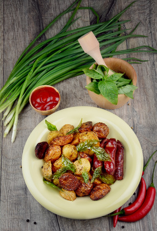 New roasted baked potato in the bowl with vegetablesの写真素材