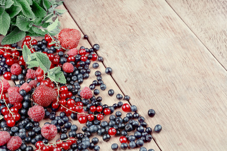 Bright summer frame of fresh sweet berries on the tableの写真素材