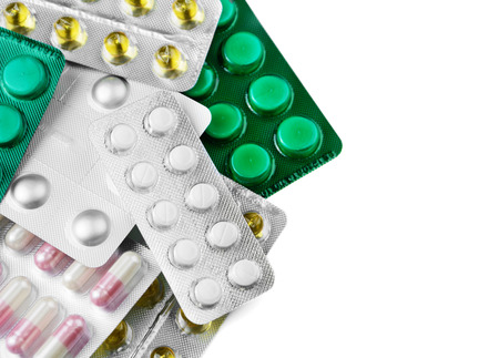 Medications on the table for treating patients on the white background