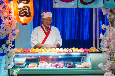 male cooks preparing sushi in restaurant kitchen, thailandのeditorial素材