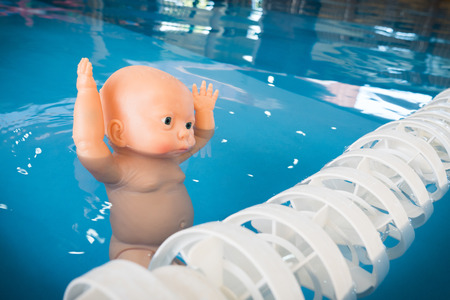 The dangers of children drowningの写真素材