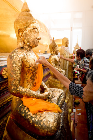Chanthaburi , Thailand - MAY 11 : Thai Buddhist People doing cover Statue of Buddha with Gold Leaf. This is Tradition Culture of Thai Buddhist on May 11, 2017 in Chanthaburi, Thailandのeditorial素材