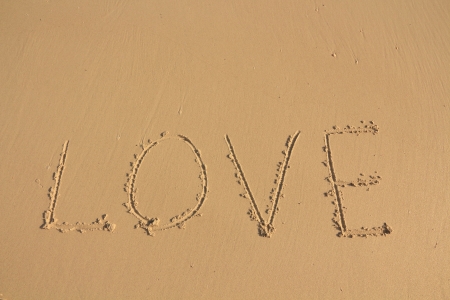 The Inscription on the Sand near the Sea - LOVE の写真素材