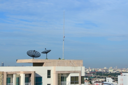 Satellite Dish on the Roof with Blue Sky  の写真素材