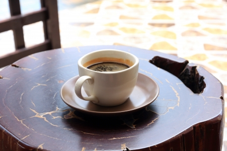 Cup of Black Coffee on a Wooden Table の写真素材