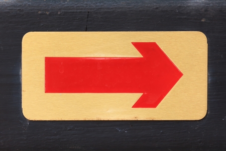  Red on Golden Backgound Right Arrow on Wooden Label の写真素材