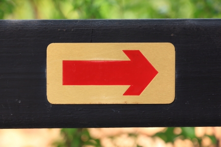 Red on Golden Backgound Right Arrow on Wooden Label 