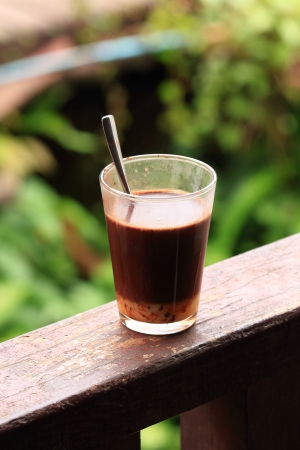 Old Style Thai Coffee on a Wood Bar の写真素材