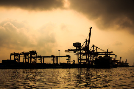 Silhouette  Scenery of the Shipyards near River の写真素材