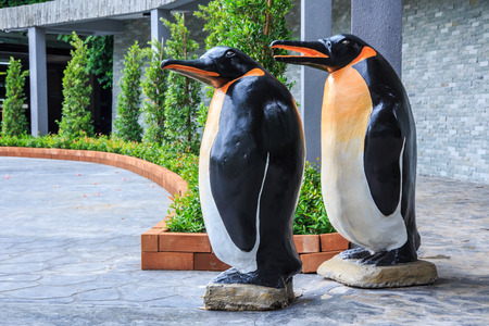 Pair of Statue Penguins Stading at Zoo の写真素材