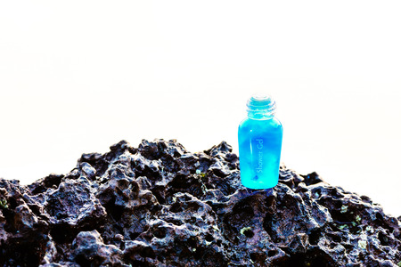 Spa shower gel on laterite hanger on white background.の写真素材