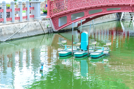 Water wheel floating on canal city.