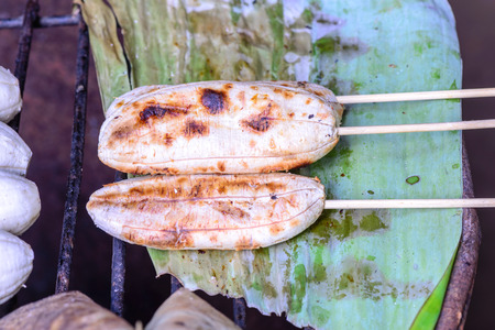 Grilled banana on banana leaf.の写真素材