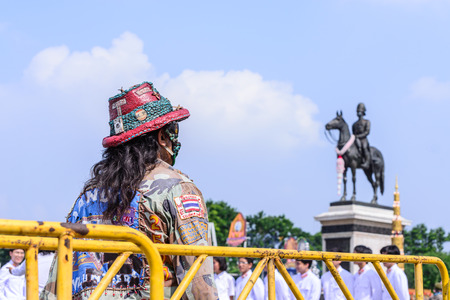 BANGKOK, THAILAND - 2015 October 23: Unidentified Thai people standing to show respected to the King Rama VI of Thailand on Chulalongkorn day in Bangkok, Thailand.のeditorial素材