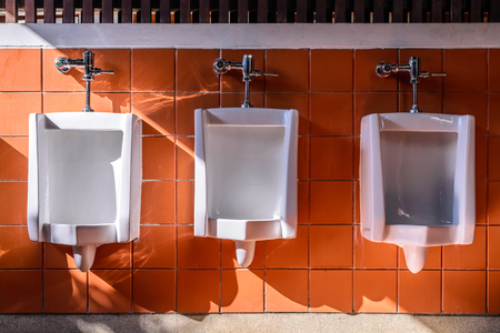 Row of uninals for men with sunlight in good environment.の写真素材