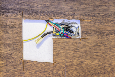 Danger electric wire on wooden control panel.の写真素材